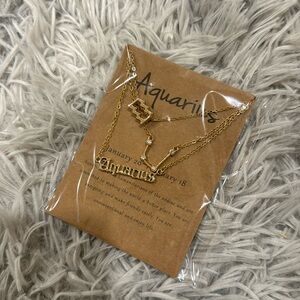 NWT Aquarius Pack of three zodiac sign necklace